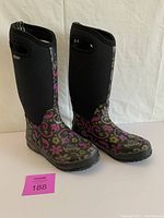 Front and side view of BOGS womens winter boots showing floral pattern and neoprene upper shaft.