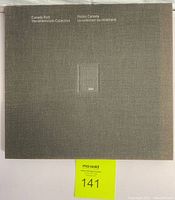 Closed view of the grey hardcover fabric album cover with 'Canada Post The Millennium Collection' printed and embossed '2000'