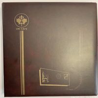 Front cover of brown album showing gold Uni-Safe branding and maple leaf logo.