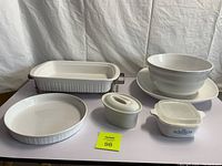 Photo showing the full assortment of white bakeware and serving dishes with CorningWare Cornflower patterned pieces included
