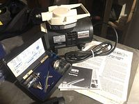 Compressor and airbrush kit with case and manuals