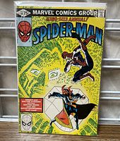 Front cover of 1980 Spider-Man No. 14 comic book showing full colorful comic art with Marvel Comics Group branding and price.