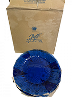 Box labeled Avon Gift Collection containing the cobalt blue plates