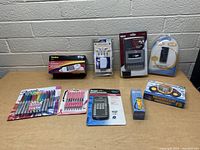 Full lot image showing all items displayed on table against a brick wall.