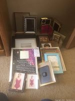 Overview of assorted photo frames with various sizes and styles including decorative and plain finishes