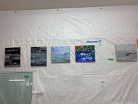 Five abstract acrylic paintings hung on a white textured wall, showing the entire set side by side.
