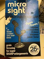 Photo of original blue box of Micro Sight enlarger grain focussing scope with product information and image of the scope.