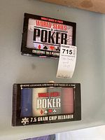 Top view showing World Series of Poker collectible tin and 7.5 gram chip reloader box with chips inside.