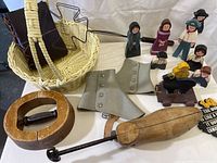 Set of painted wooden figures with basket and shoe forms, showing condition and detail