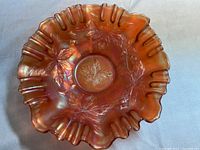 Top view of the iridescent carnival glass bowl showing maple leaves and ruffled 3-in-1 edge.