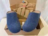 Blue fabric slippers in original FitFlop box with tissue paper.