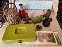 Overview photo showing all items including the green metal box, basket, MCM vase, wooden book holder, stencil sign, and small decorative items