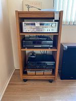 Four audio components on wooden rack: Pioneer receiver, Technics CD changer, JVC cassette deck and SME tonearm box