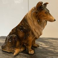 Side view of MCM ceramic collie dog planter on a marble surface.