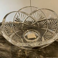 Close-up on the side of the Waterford crystal bowl displaying the intricate starburst cut pattern on clear crystal glass, showing excellent clarity and craftsmanship.