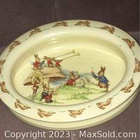 Oval Bunnykins oatmeal bowl with scene of bunnies conducting orchestra and decorative rim pattern