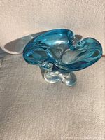 Top view showing shape, blue glass, and base.