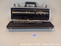 Flute in closed case showing overall condition and storage setup.