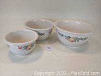 Three nesting bowls showing Corelle Abundance fruit pattern on outer rim