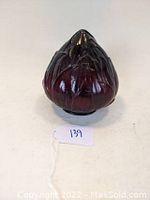 Side view showing ruby red flame light shade design and fitting rim collar