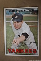 Front side of 1967 Topps Whitey Ford baseball card showing photo of player pitching for Yankees.