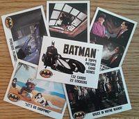 Topps Batman trading cards and stickers showing variety of scenes from 1989 Batman movie including Batman, Joker, Bruce Wayne Manor, and other scenes.