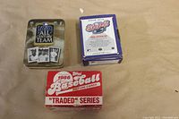 Image of the three sets boxed and tin: 1986 Topps Traded, 1991 Upper Deck Final Edition, and All Century Team tin box.