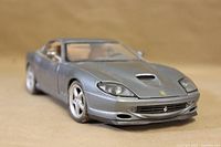 Front view of metallic silver-grey Ferrari 550 Maranello model car showing hood details and Ferrari logos