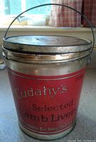 Front view of the vintage Cudahy's tin can bucket showing label and handle
