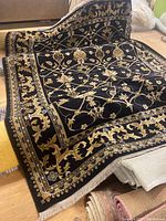 English Manor Black multicolor rug with floral and vine patterns and detailed border.