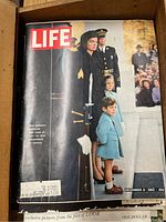 Close-up image of the Life magazine December 6, 1963 cover featuring Mrs. Kennedy and children at a procession.
