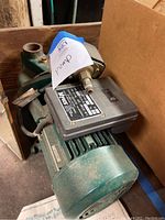 Myers jet pump angled view showing green motor and black electrical box with label