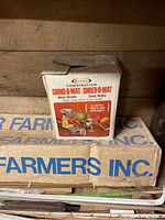 Photo of the vintage Rival Combination Grind-O-Mat meat grinder box on a shelf