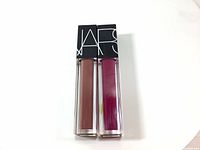 Two new Nars Velvet Lip Glide liquid lipsticks side by side, showing colors La Main Bleue and Xenon.