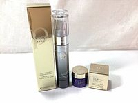 Photo showing full set side by side: serum bottle with box, cream jar with box on white background