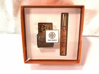 Front view of the sealed gift box with the two fragrance items inside: the 30ml spray bottle and 6ml rollerball.