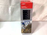 Front view of the original box packaging with branding and window showing tripod.