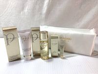 Full set showing all items including boxed products and cosmetic pouch with branded cotton sheets.