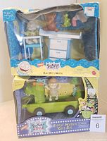 Photo showing both toy sets in original packaging with visible wear on boxes.