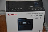 Photo of the Canon ImageCLASS MF212W printer original box showing model and features.
