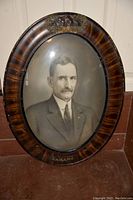 Full view of oval tiger stripe frame with portrait inside