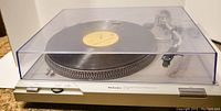Full front view of Technics turntable with dust cover closed