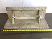 Photo showing full shelf from top looking down with ruler for dimension scale.