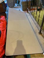 Top view of the clean, light-colored Formica tabletop with rounded edges.