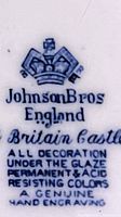Close-up of backside mark showing Johnson Bros England Britain Castle underglaze mark with hand engraving call out.