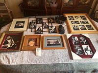 Overview photo showing all nine framed prints and blues-themed items on a table, revealing a variety of sizes and frames.
