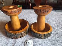 Pair of wood candlesticks with matching wood bowl bases, tops have bark edge detail, showing natural wood tone and texture.