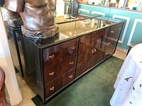 Front view of credenza showing six drawers and central double doors