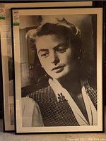 Framed black and white poster of Ingrid Bergman, sized 30 x 42 inches, photographed leaning against wall.