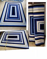 Photo of two blue and white geometric rugs, one flattened showing full design, and one folded showing material and colors.